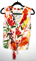 Cleo tie-front V-neck floral blouse in bold painterly orange red and green botanical print on hanger