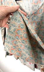 Close-up of 3/4 sleeve on Mahla women’s blouse showing soft modal fabric and sage green coral geometric pattern.