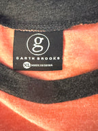 Close-up of Garth Brooks neck tag showing XL size and official branding.