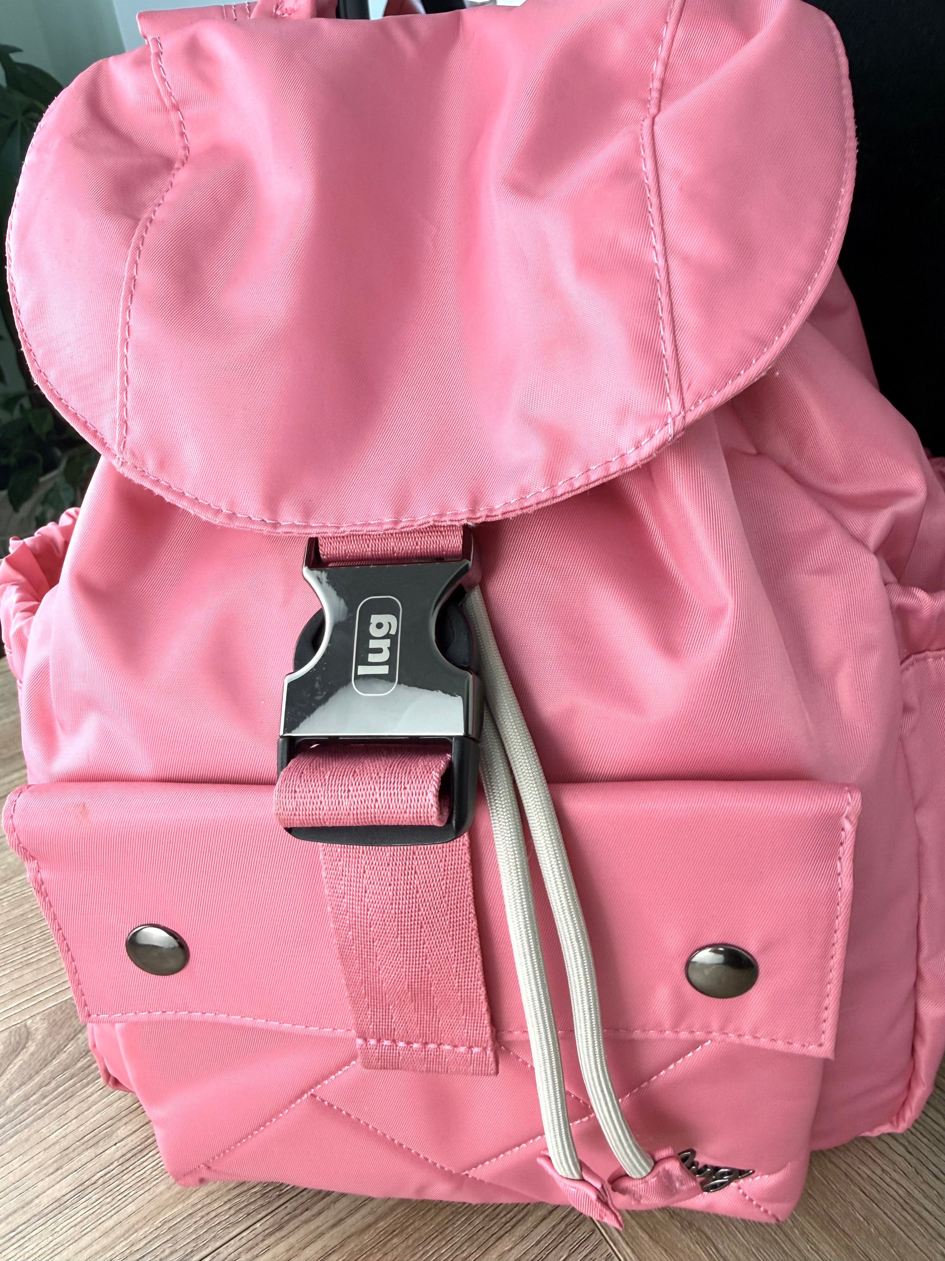 Close-up of Lug buckle and front pocket on pink Lug Wiffle backpack