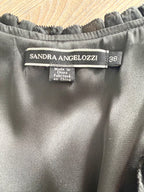 Close-up of Sandra Angelozzi brand label showing size 38.