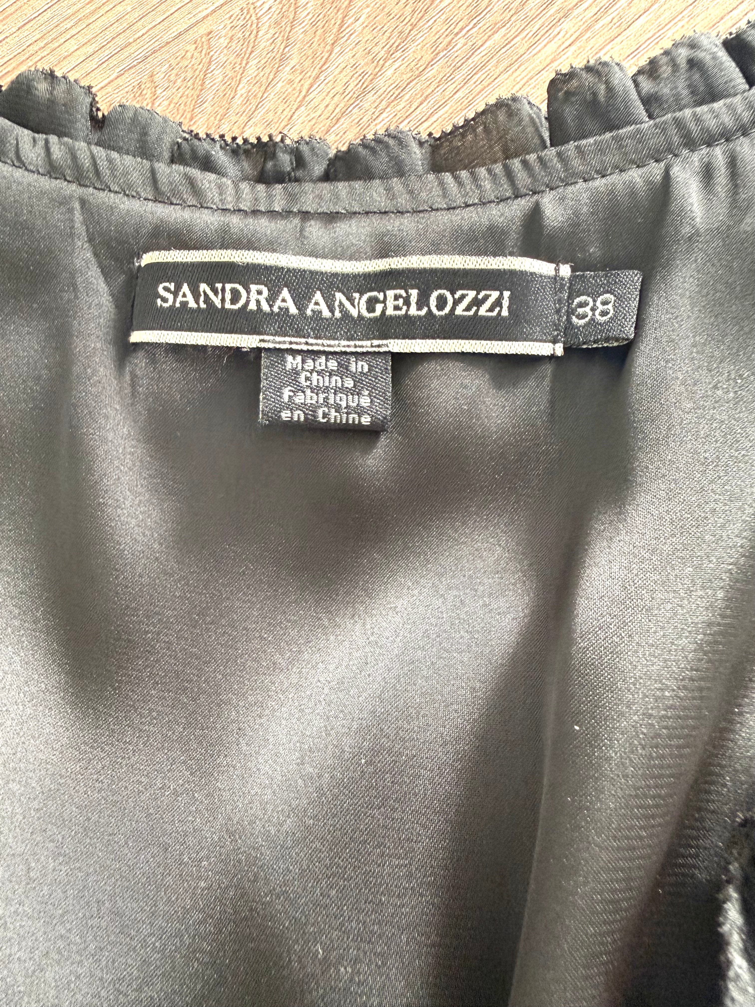 Close-up of Sandra Angelozzi brand label showing size 38.