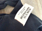 Smash + Tess romper revolution tag detail.