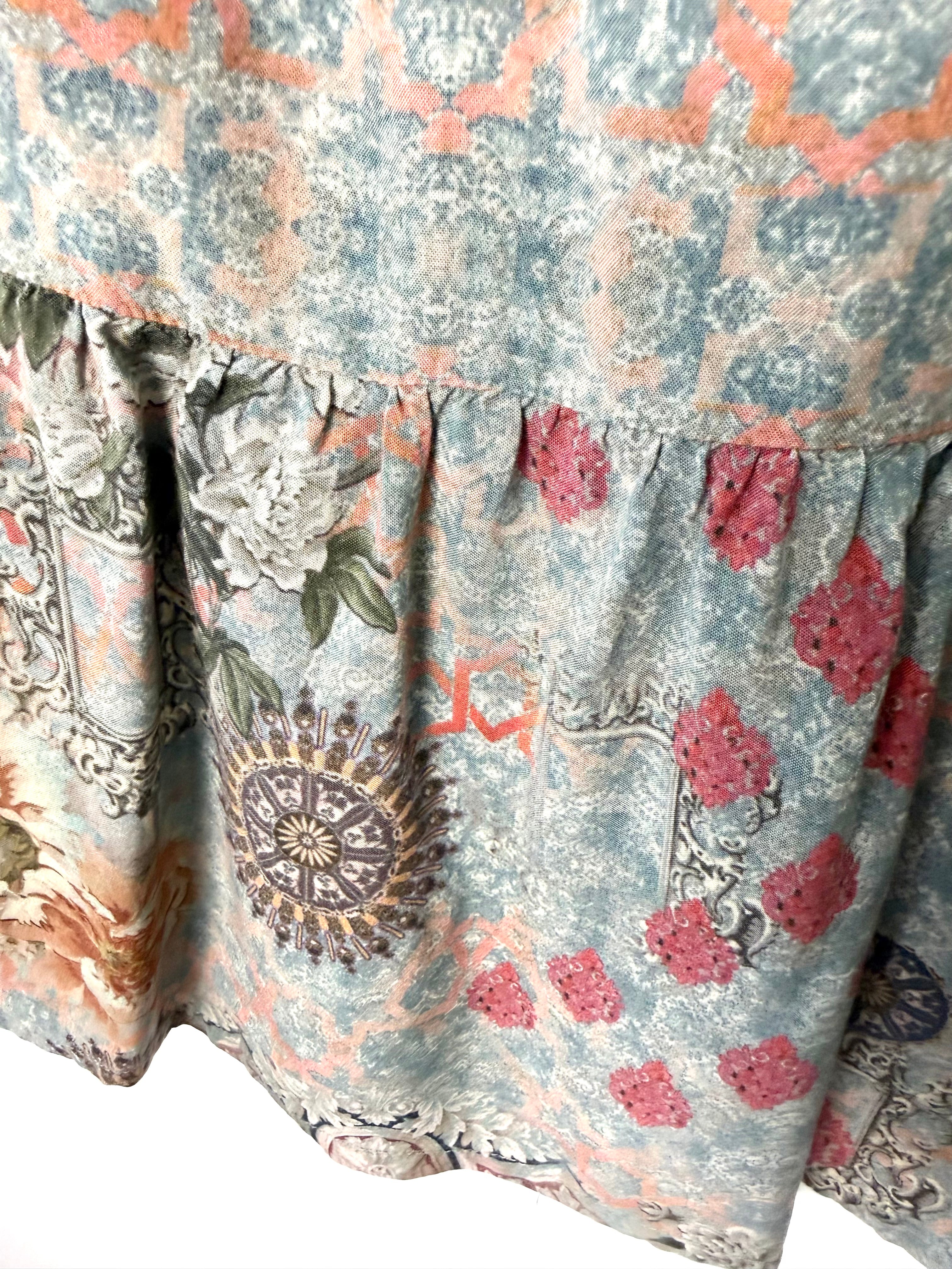 Close-up of mixed floral and geometric border print on Mahla boho peplum blouse showing soft drape and lightweight modal texture.