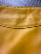 Close up of Enzo Bertini embossed logo on yellow Italian leather handbag