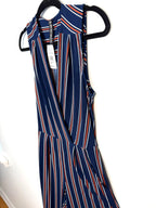Close up of wrap front V neckline navy striped jumpsuit NWT  on hanger