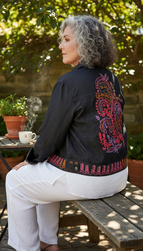 Coldwater Creek Embroidered Denim Jacket | Size XL at Blue Sparrow Shop showing back of jacket on woman at outdoor cafe