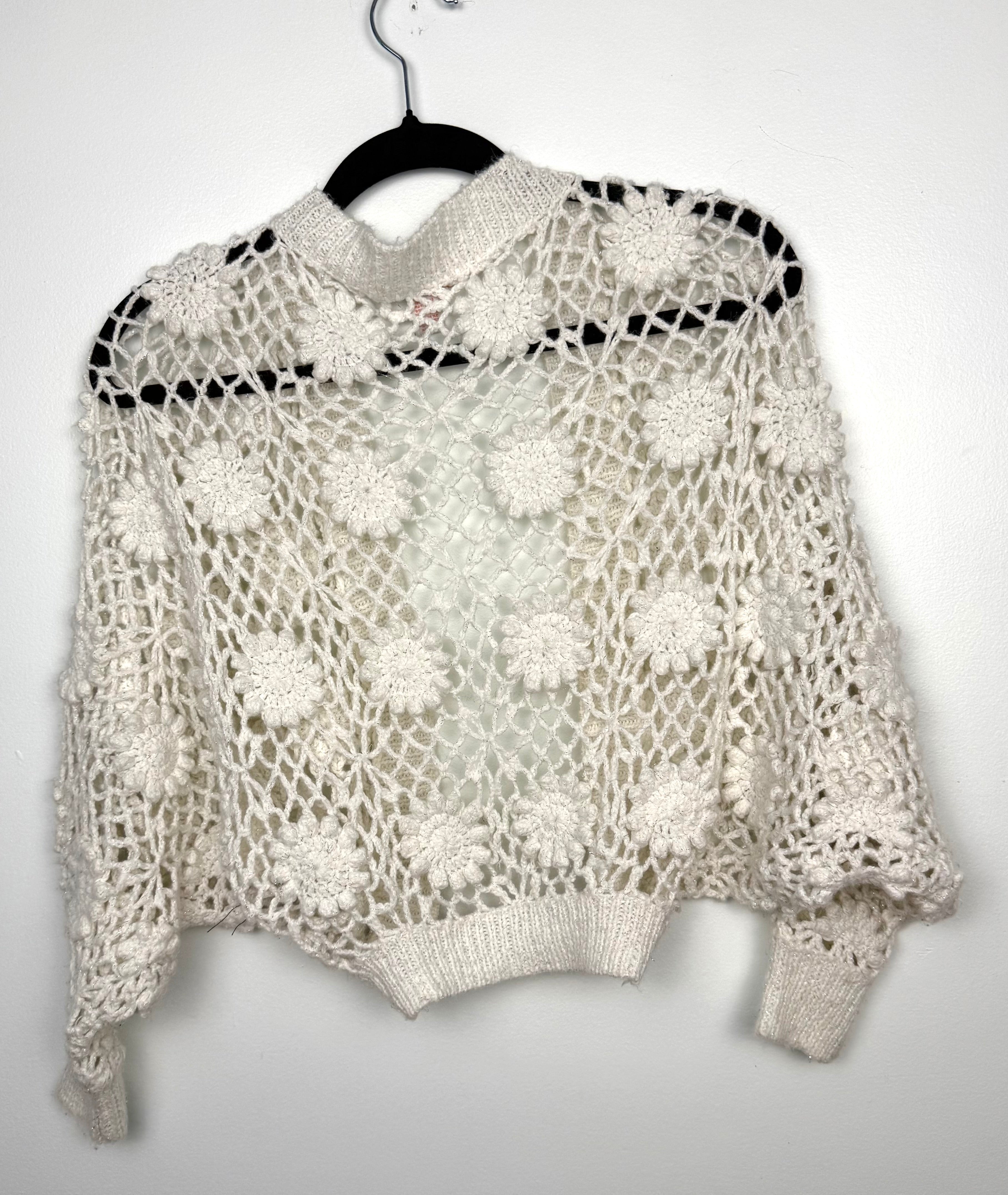 Cottagecore crochet look shrug  back view  on hanger