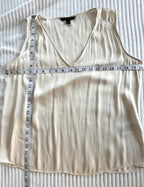 Cream Banana Republic sleeveless blouse featuring a V-neckline, gathered shoulder detail, relaxed silhouette, and fluid drape throughout the body measuring 40" bust and 23" shoulder to hem