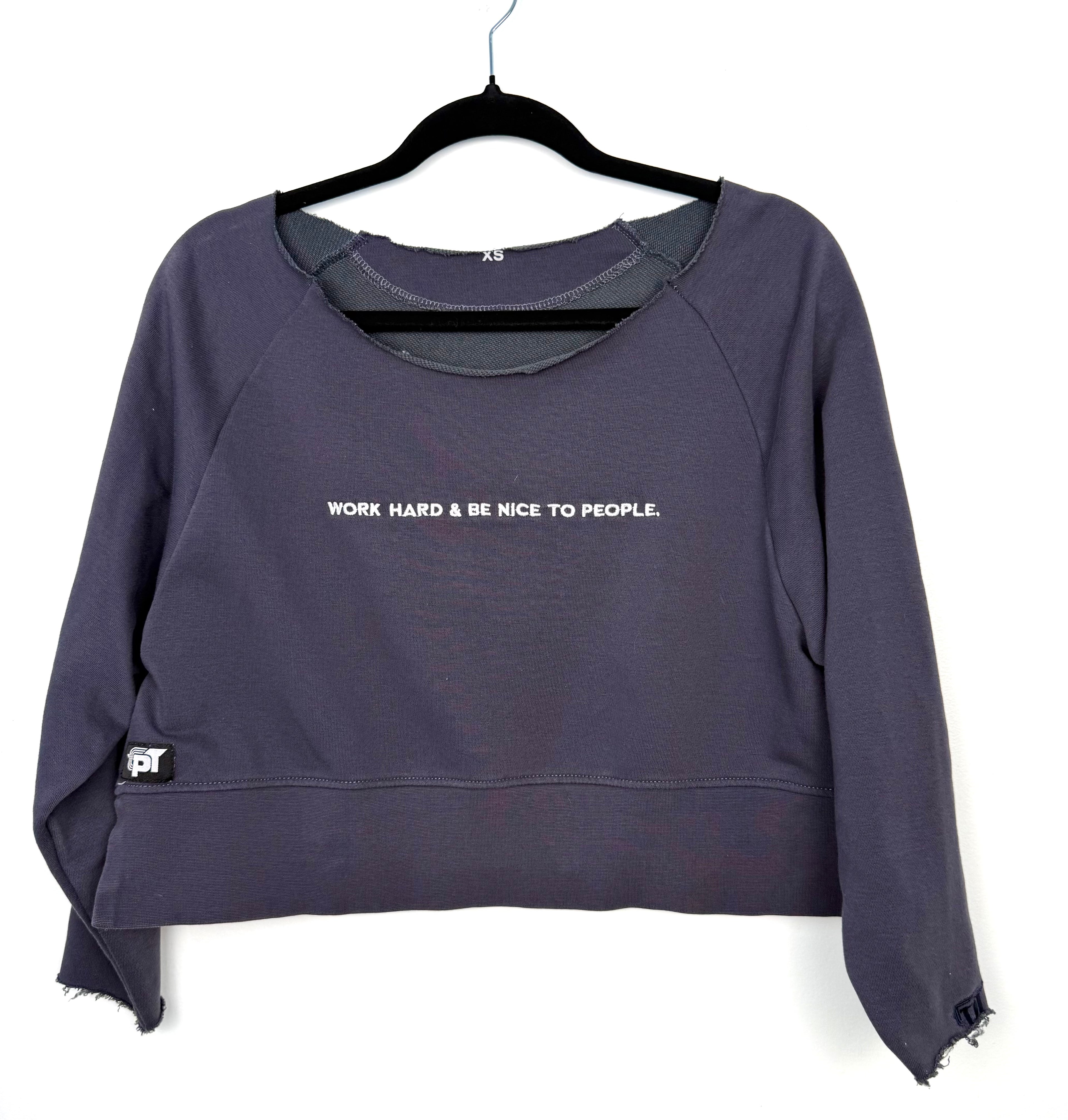 Cropped athleisure sweatshirt work hard be nice to people saying on front 