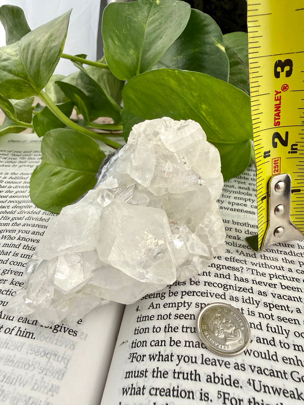 Apophyllite crystal with measuring tape showing it to be approx 3" high 