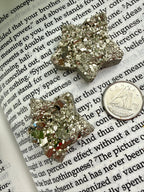 star shaped pyrite with a dime to show size 