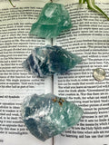 3 x fluorite crystals on an open book
