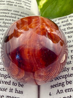 up close of carnelian sphere with striations