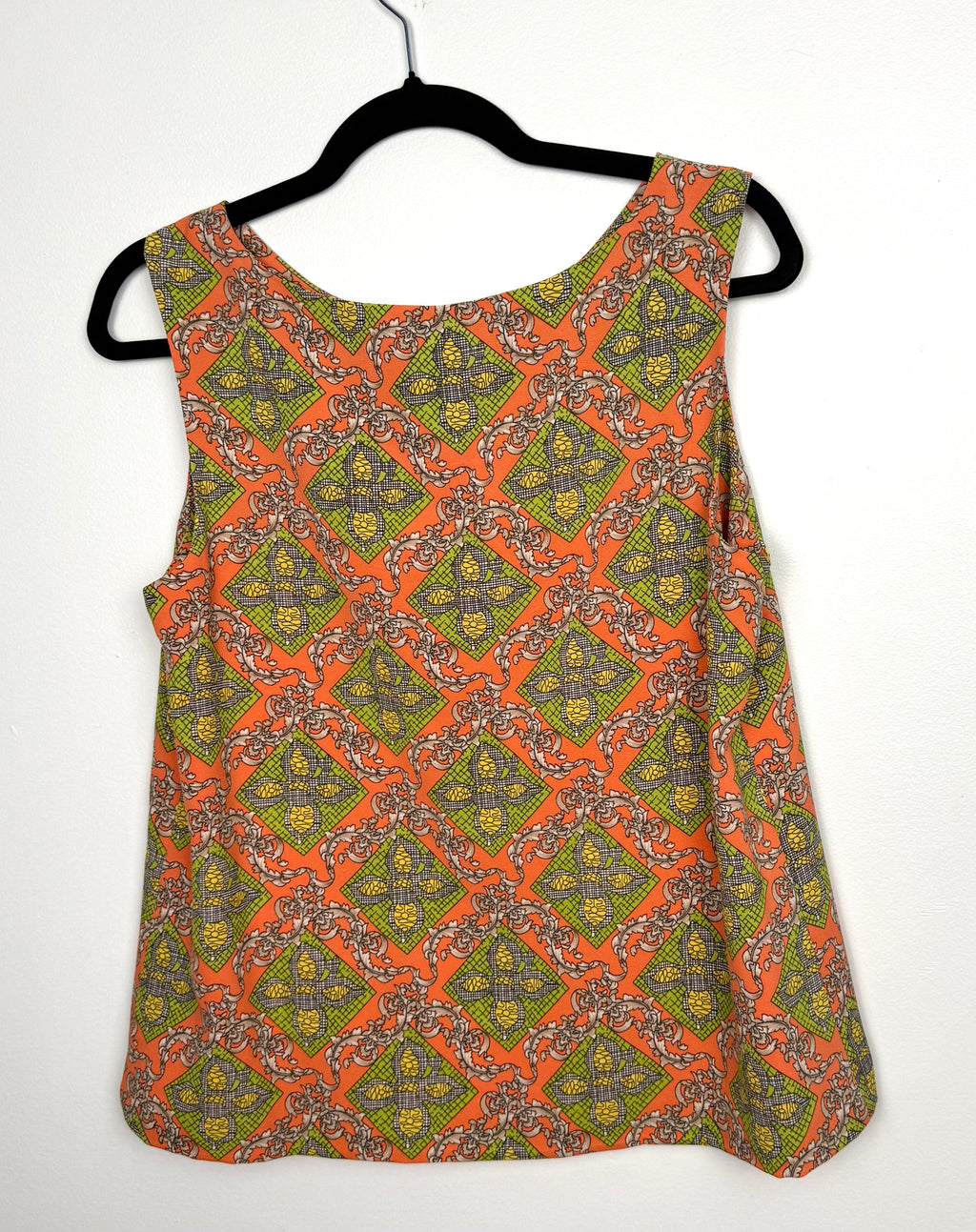 Darling sleeveless blouse back view orange lime green geometric print women’s statement top