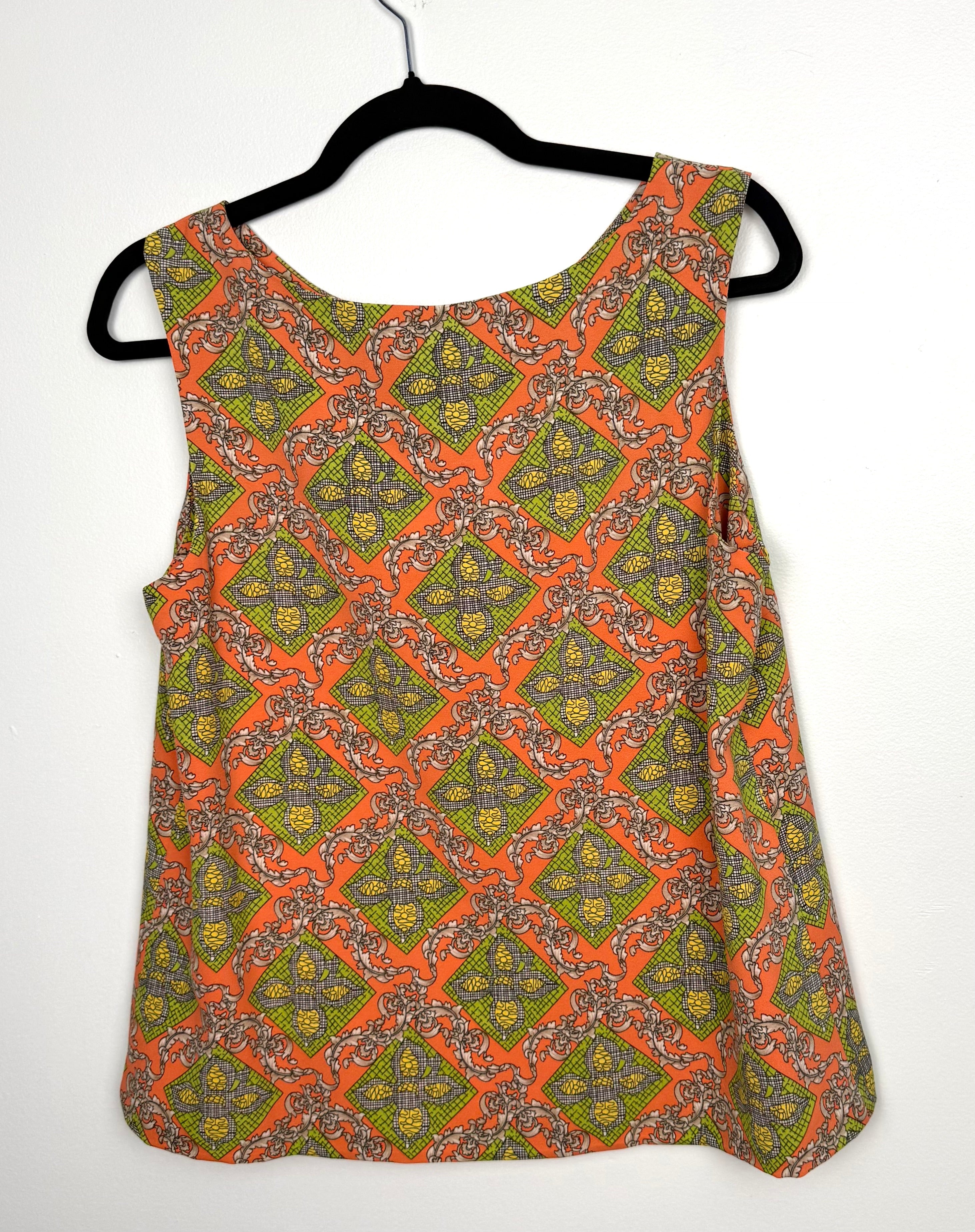Darling sleeveless blouse back view orange lime green geometric print women’s statement top