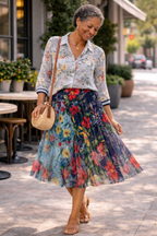 Desigual Patchwork Skirt at Blue Sparrow Shop on woman outside -pattern on pattern look shown with Denim Hunter Rex dress/shirt