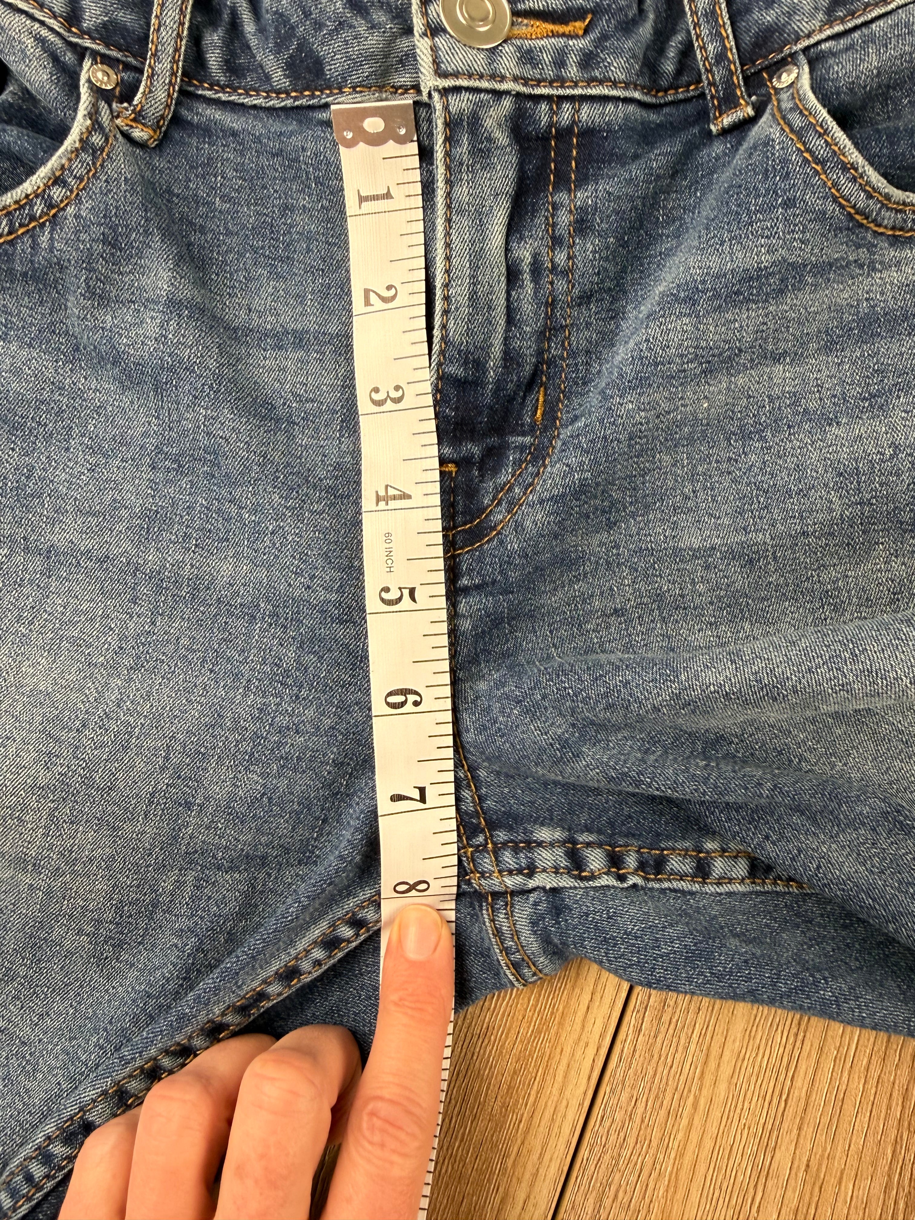 Dex embroidered feather skinny jeans medium wash distressed raw hem at Blue Sparrow Shop measuring 8" rise