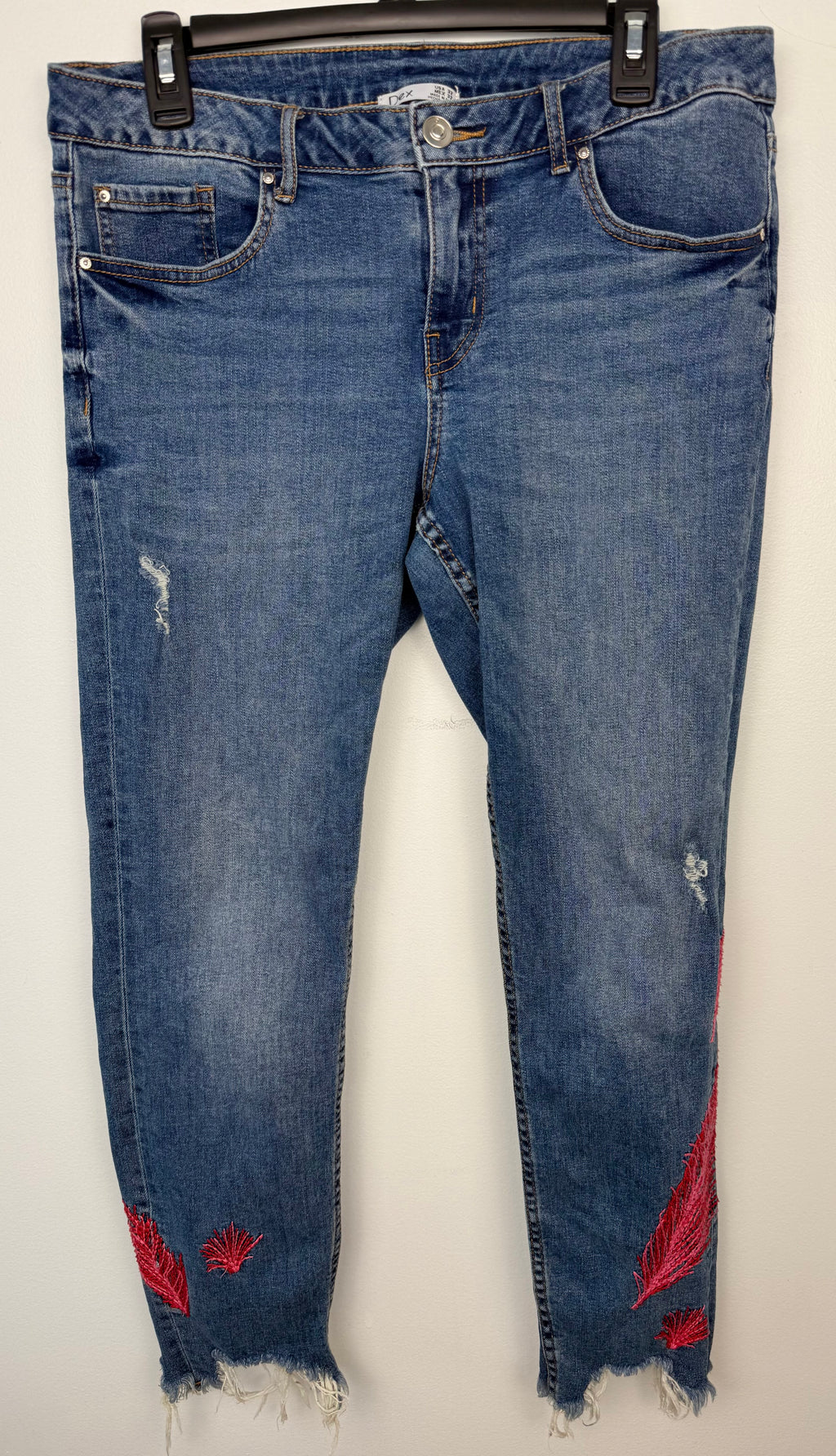 Dex embroidered feather skinny jeans medium wash distressed raw hem front view size 32 — Blue Sparrow pre-loved Canadian brand fashion on hanger