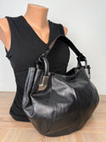 Dissona genuine leather black hobo shoulder bag at Blue Sparrow Shop Resale Canada  on mannequin to show size