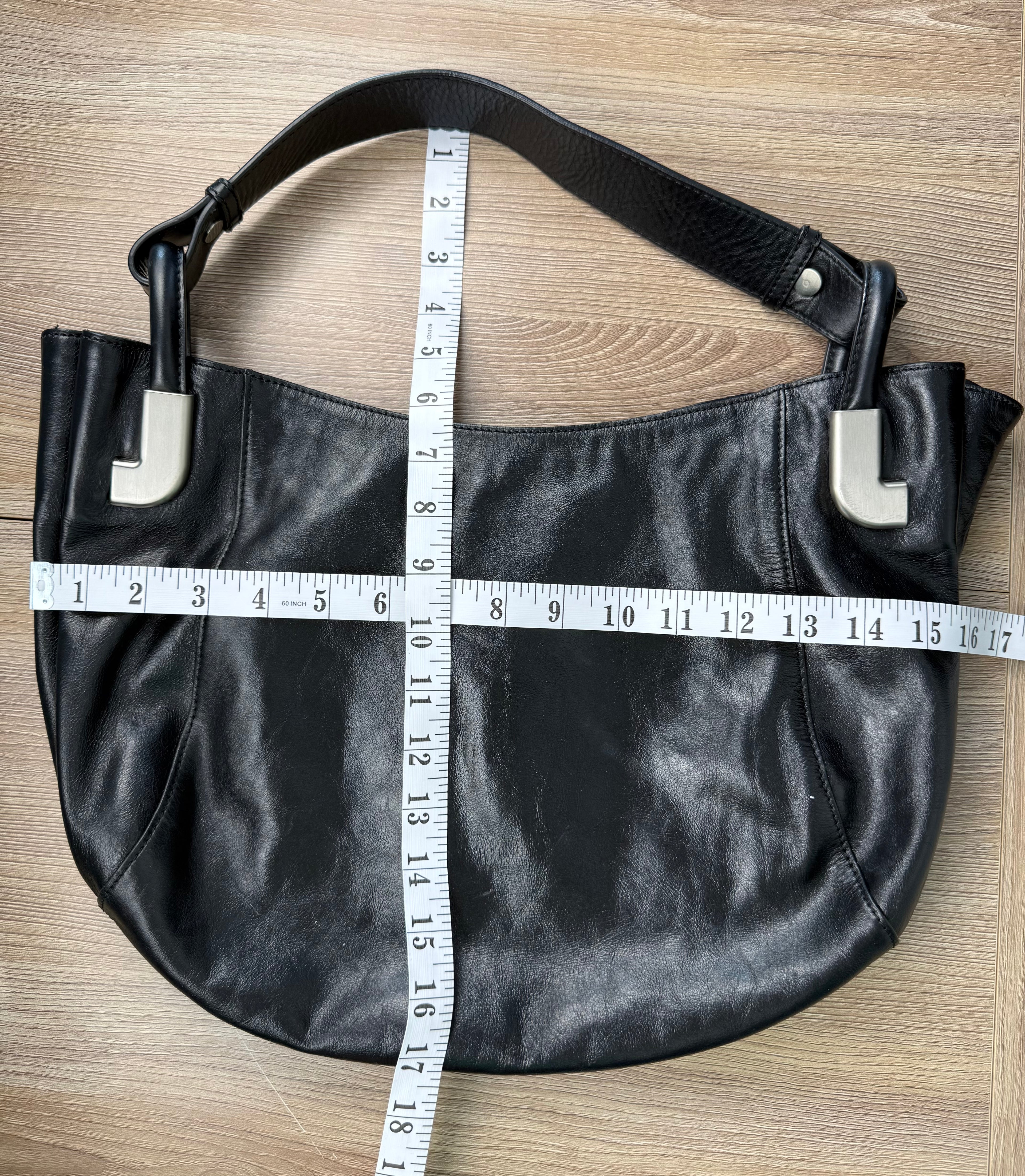 Dissona genuine leather black hobo shoulder bag at Blue Sparrow Shop Resale Canada  measuring 16" by 10" 