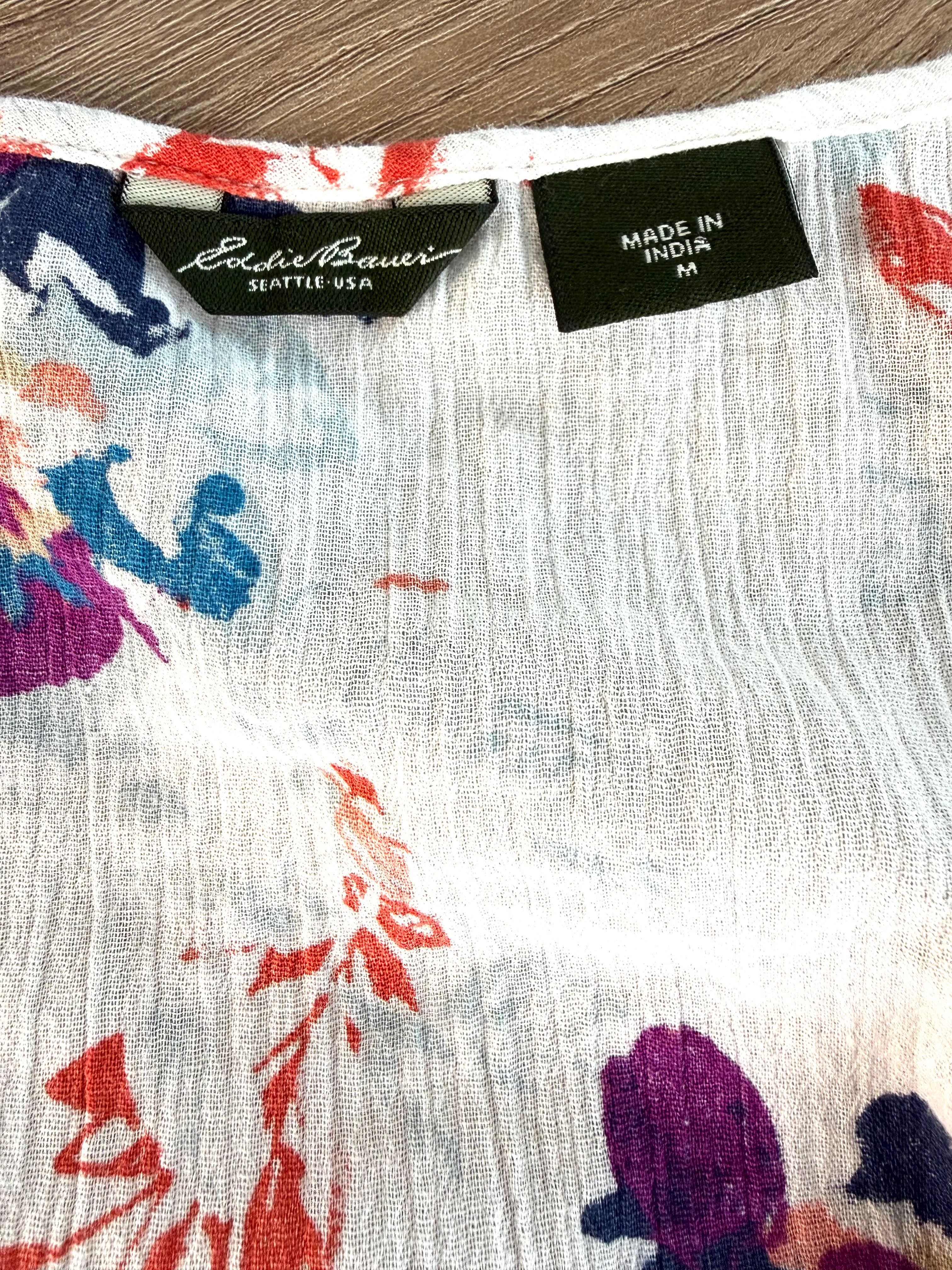Eddie Bauer Seattle USA label and Made in India size medium tag on white floral crinkle gauze tank top — quality pre-owned women's clothing at Blue Sparrow