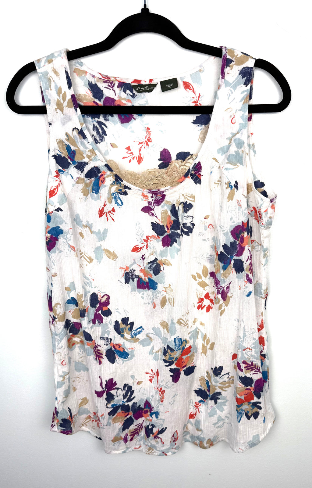 Eddie Bauer white floral crinkle gauze sleeveless tank top with gold lace neckline trim, size medium, hanging on black hanger — Blue Sparrow sustainable women's fashion