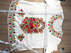 Embroidered Floral Tunic Blouse measuring 26" shoulder to hem and 44" bust