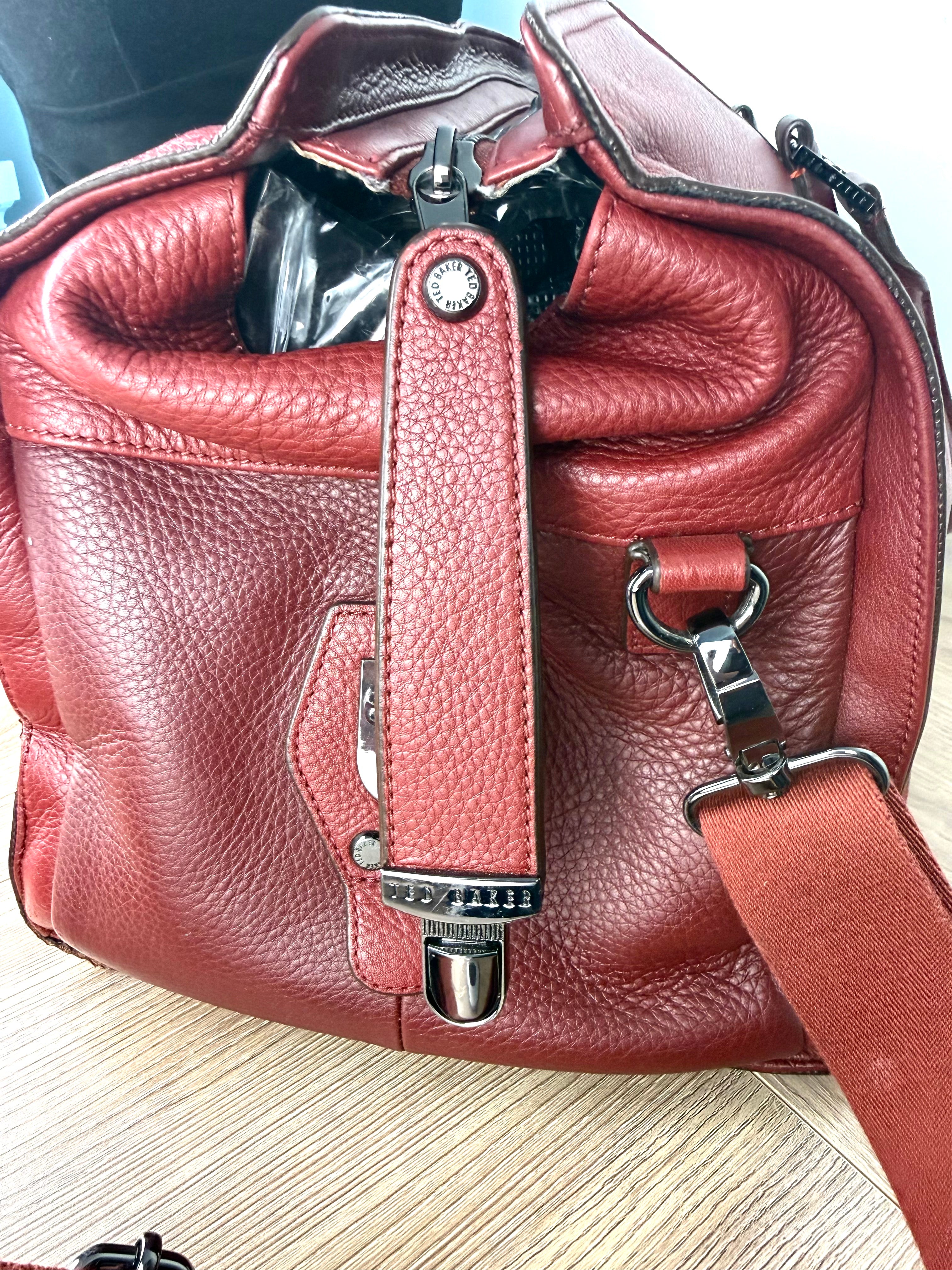 End cap / hardware on Ted Baker London Leather Travel Bag