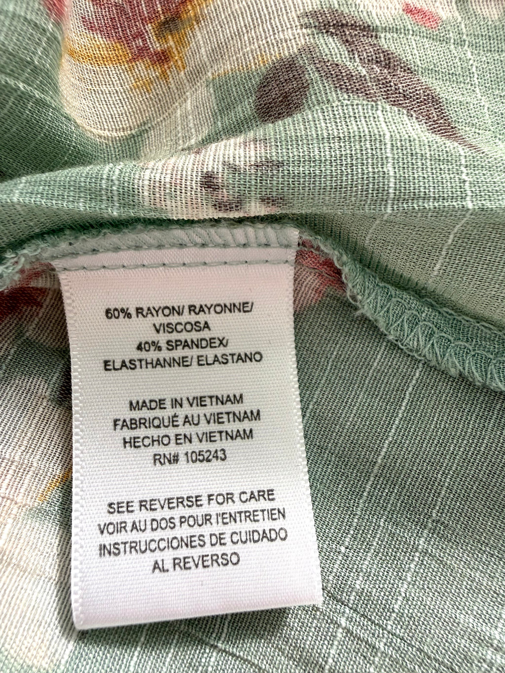 Rayon spandex fabric content tag on MOD Lusive floral blouse