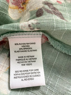 Rayon spandex fabric content tag on MOD Lusive floral blouse