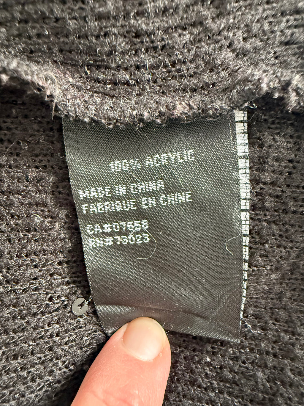 Fabric content tag showing 100 percent acrylic material
