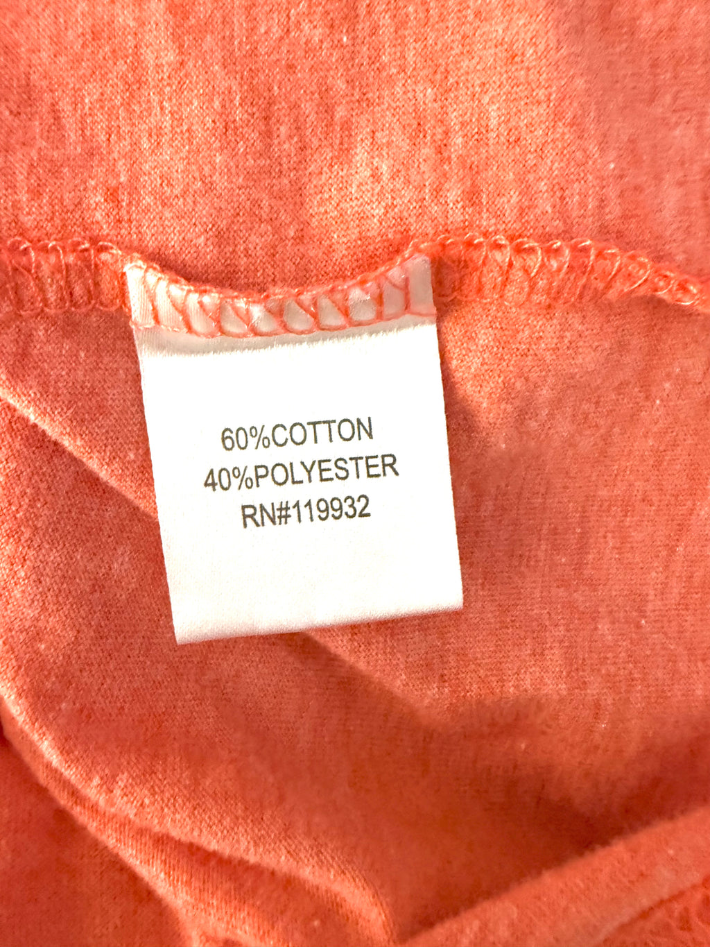 Fabric content tag showing 60% cotton, 40% polyester blend on Garth Brooks concert tee