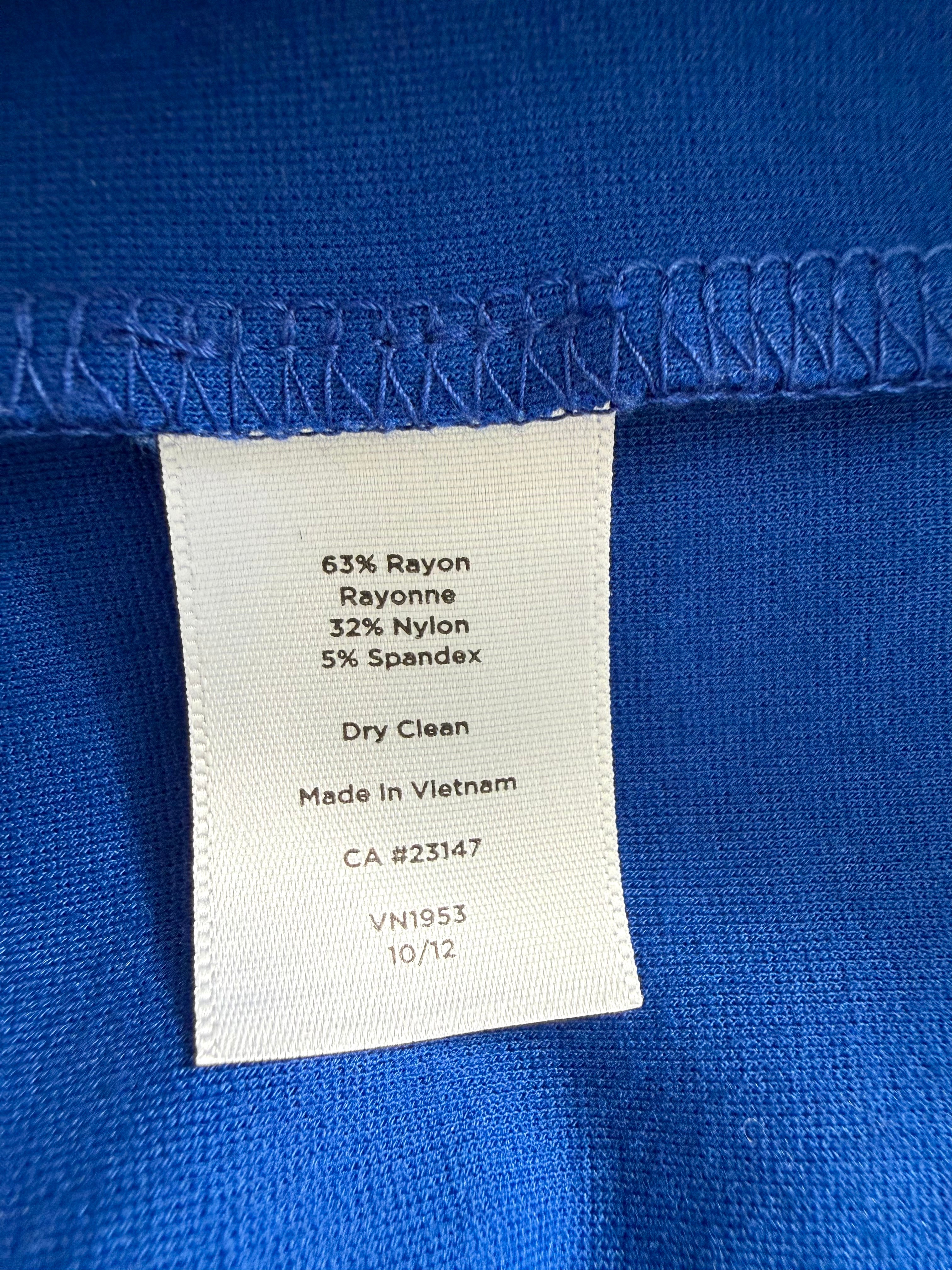 Fabric content tag showing 63% rayon, 32% nylon, 5% spandex, dry clean only, made in Vietnam.