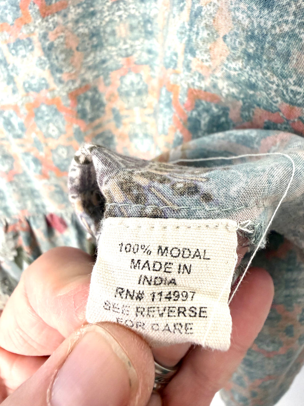 Fabric tag showing 100% modal composition and made in India manufacturing details on Mahla women’s blouse.