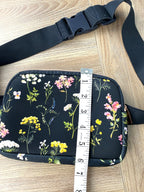 Floral cross body belt bag in navy measuring 6" deep 