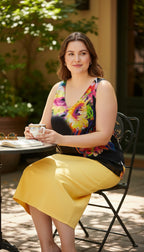 Frank Lyman — Bold Abstract Floral Sleeveless Top, Fully Lined, Size L at Blue Sparrow Shop on woman sitting outdoors drinking tea 