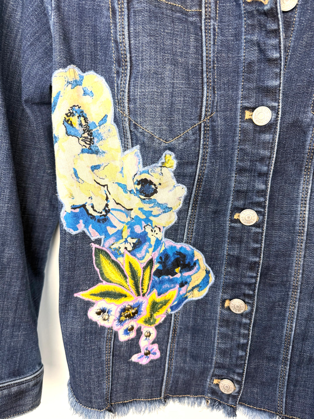 front decal detail on Chicos embroidered denim jacket 