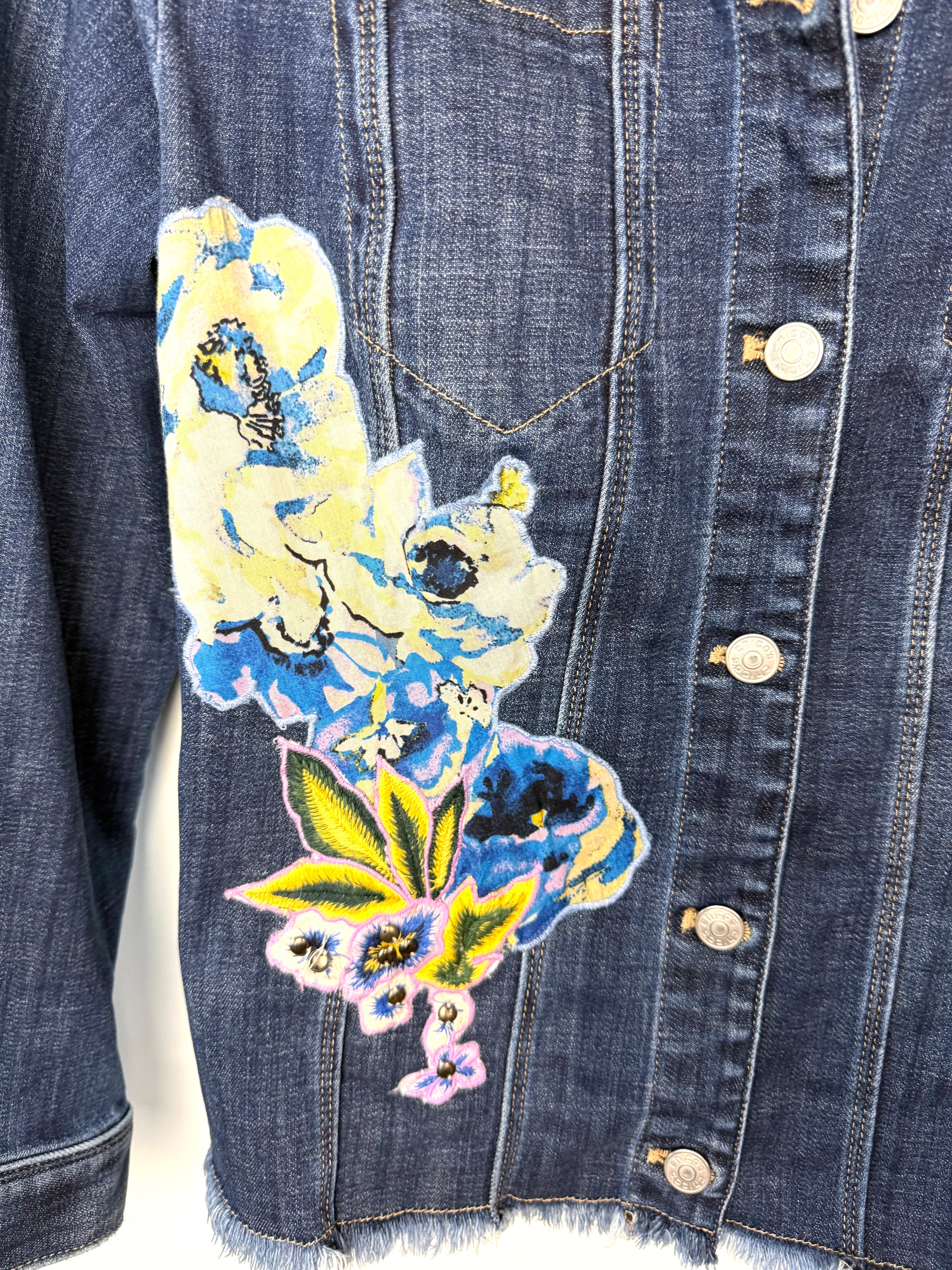 front decal detail on Chicos embroidered denim jacket 