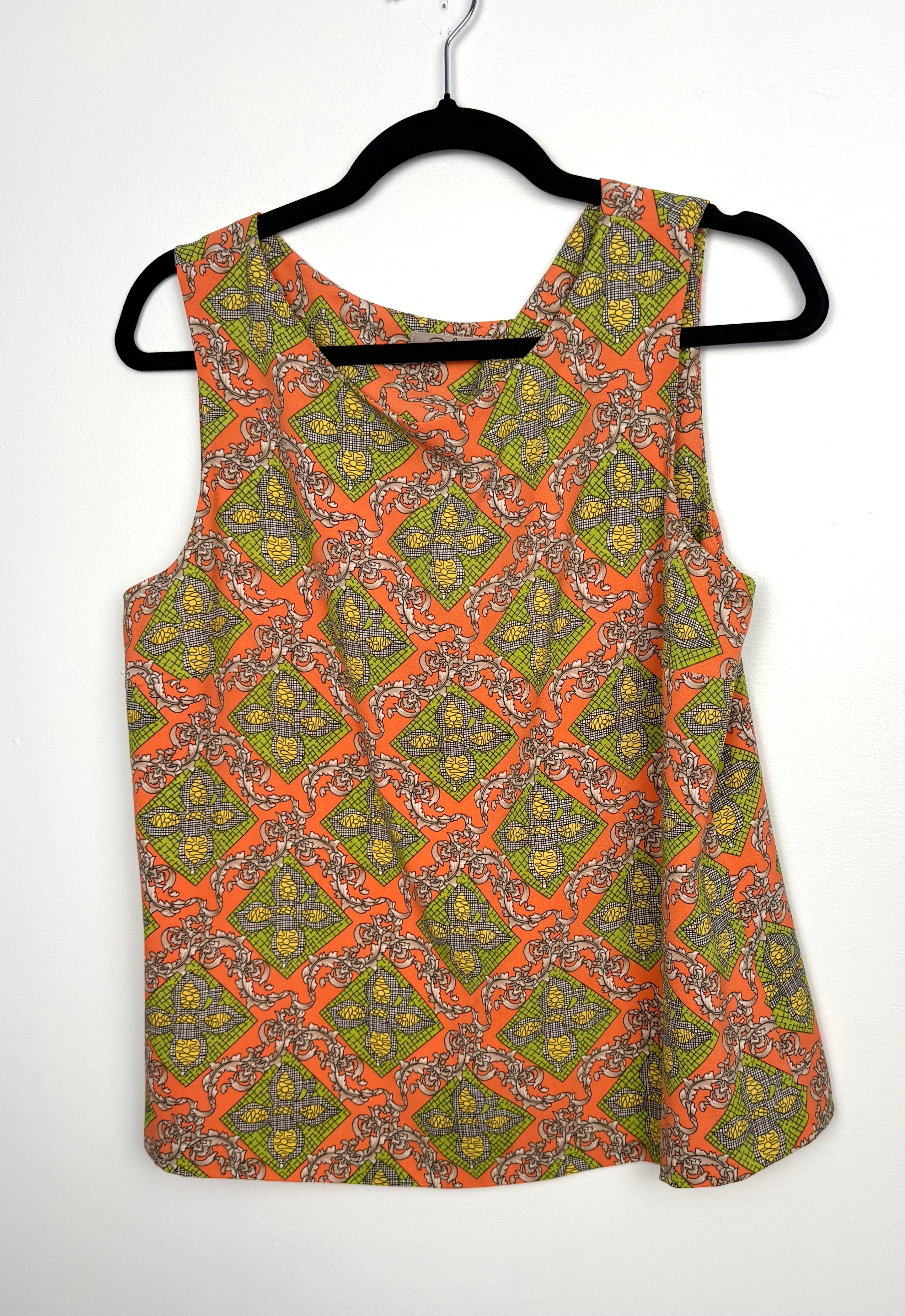 Front view of Darling Louisa Top sleeveless blouse in orange and green baroque print