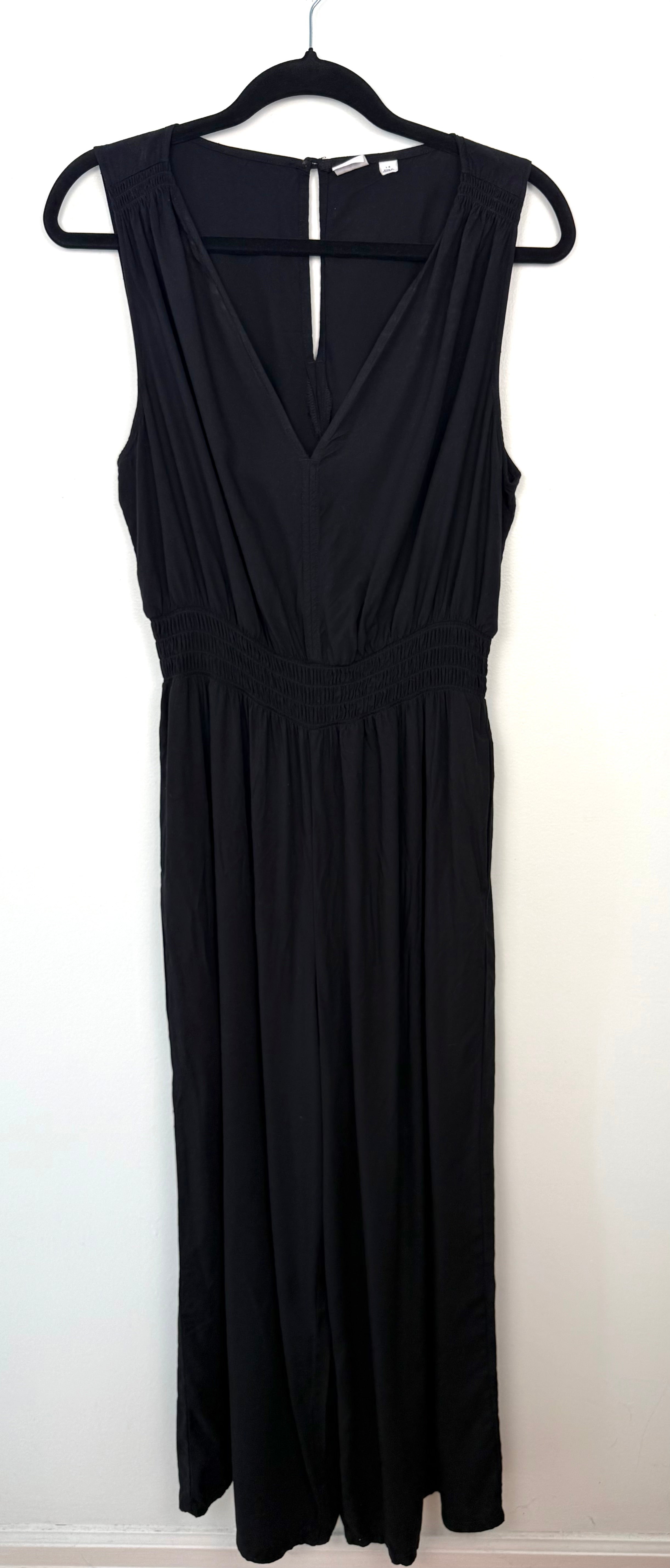 GAP black sleeveless wide leg jumpsuit size large with deep V neckline and elastic waist front view