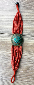 Red multi strand seed bead bracelet with turquoise inlay medallion centre artisan boho style jewellery
