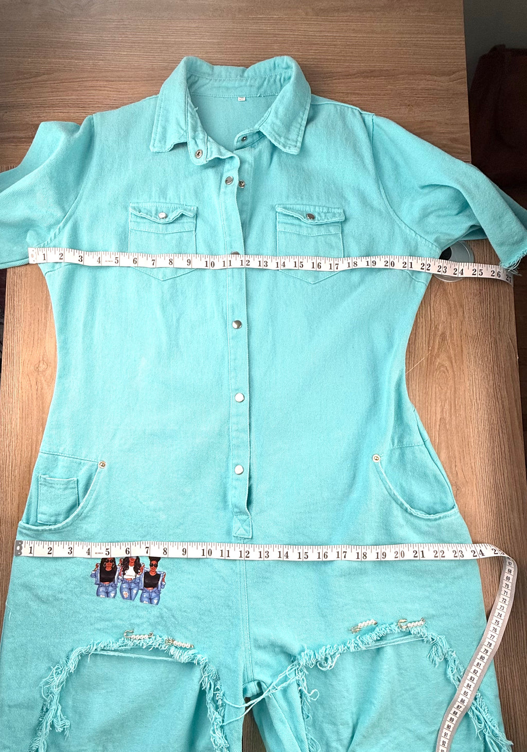 Graphic Streetwear Jumpsuit measuring 44" bust and 48 hips 