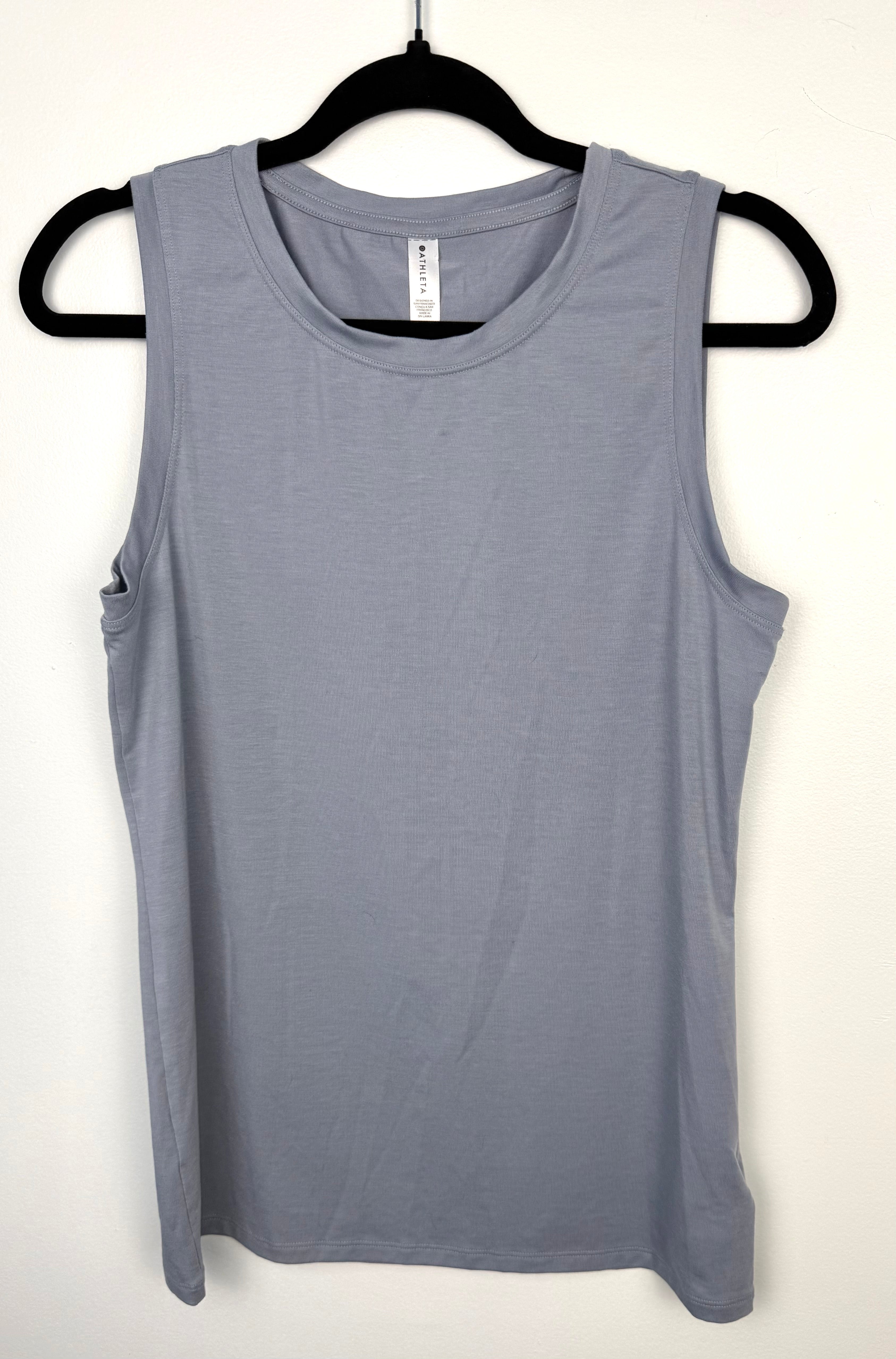 Grey Athleta Vital Tank 2.0 sleeveless top, lightweight performance fabric, minimalist athletic layering piece on hanger