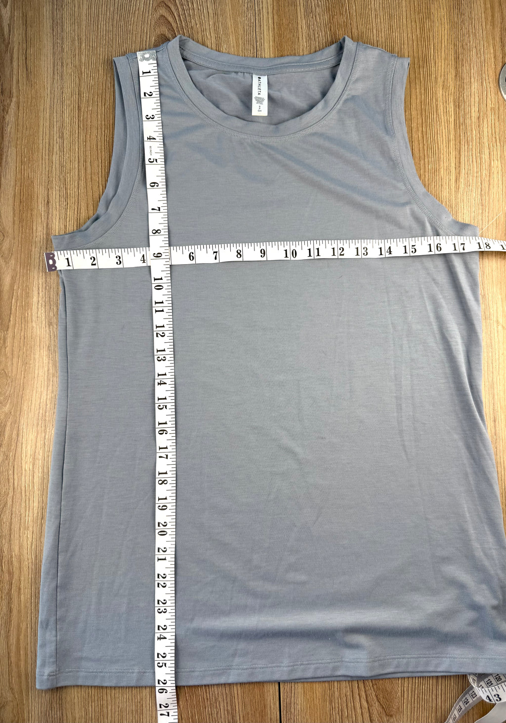 Grey Athleta Vital Tank 2.0 sleeveless top, lightweight performance fabric, minimalist athletic layering piece measuring 36" bust and 26" shoulder to hem 