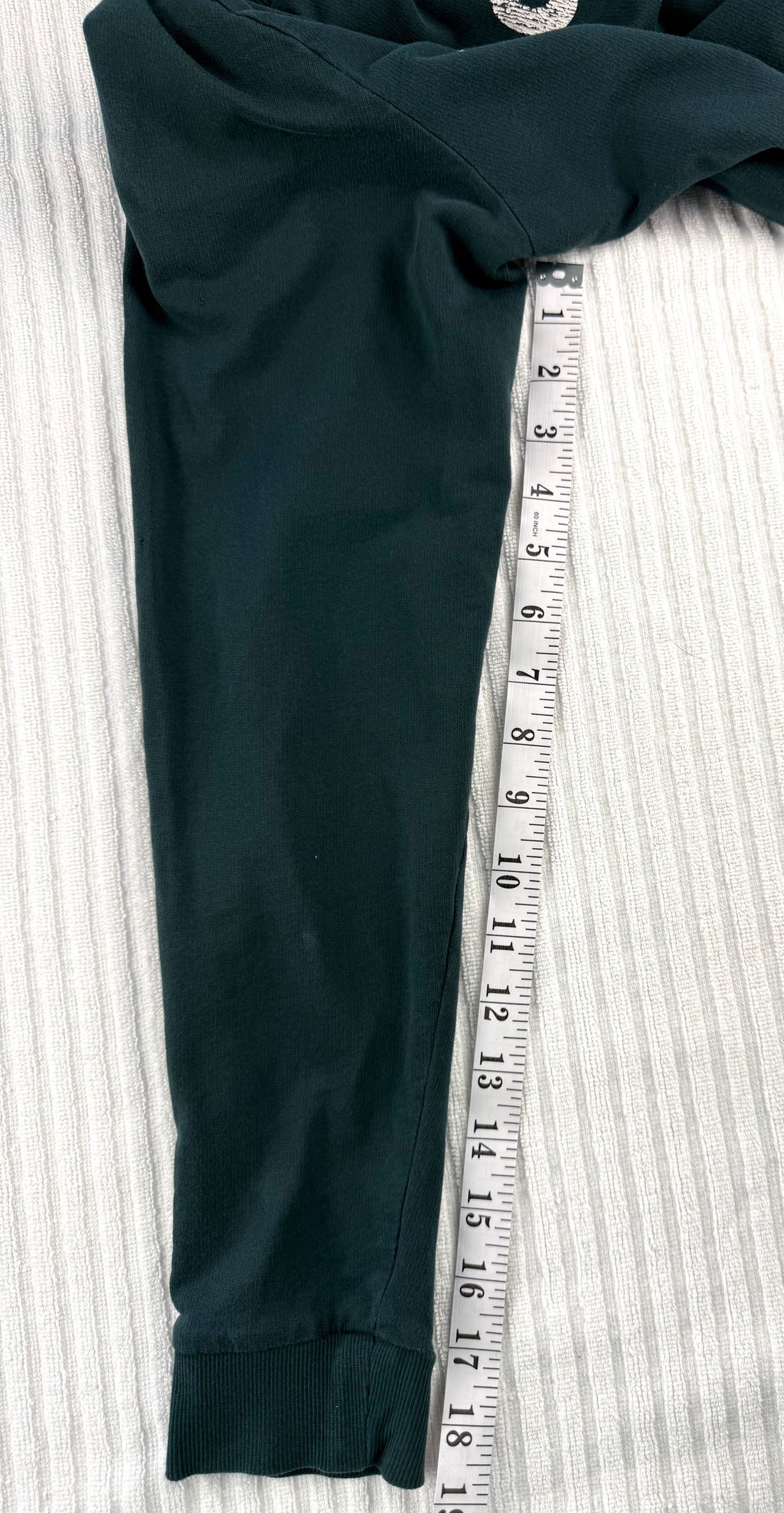 H&M Divided teal green 100% cotton graphic crew neck sweatshirt with "Property of No One" distressed white lettering, front view on hanger — Blue Sparrow pre-loved women's fashion measuring 19" sleeve 