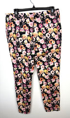back of H&M Slim Fit Ankle Pants with floral pattern on hanger