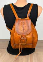 Handcrafted Artisan Boho Leather Rucksack shown on the back of mannequin 