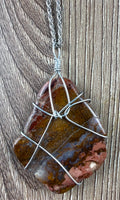 Handcrafted wire-wrapped genuine jasper stone pendant necklace on silver rope chain at Blue Sparrow Shop - close up of pendant 