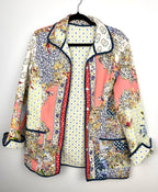 Handmade Reversible Quilted Patchwork Jacket on hanger
